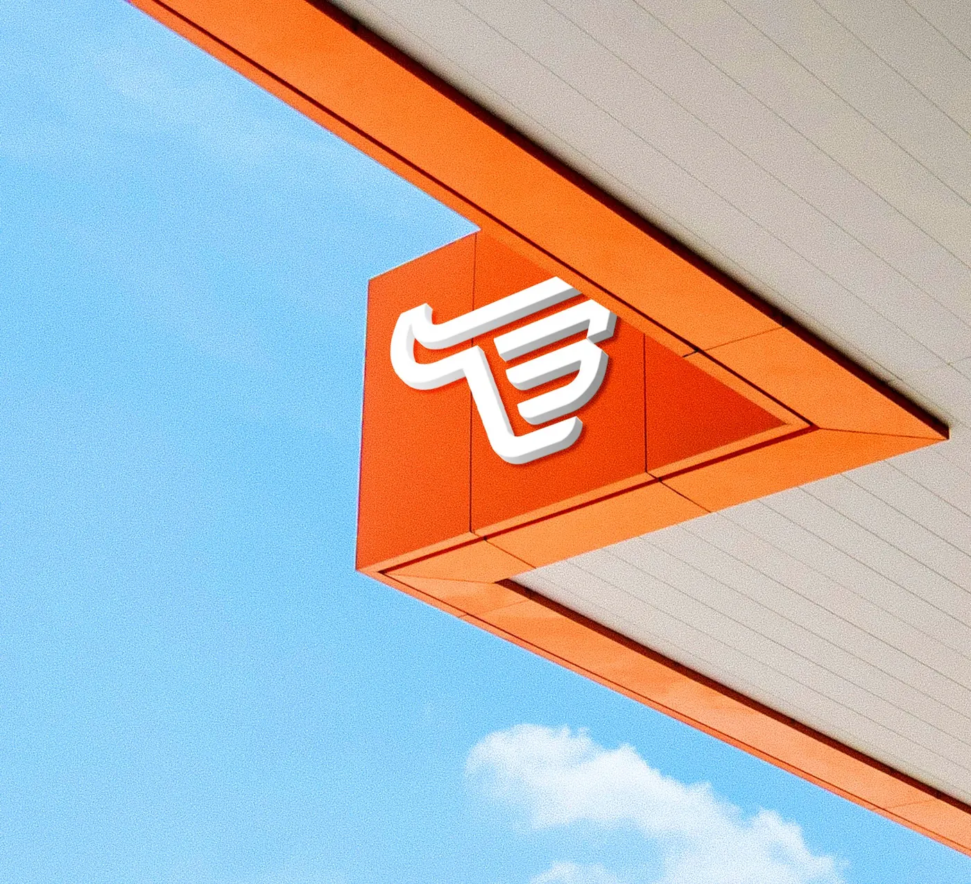 3D Bullcom symbol on an orange storefront